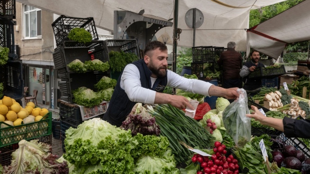 A vendor sells vegetables at the Friday Bazaar market in Istanbul.