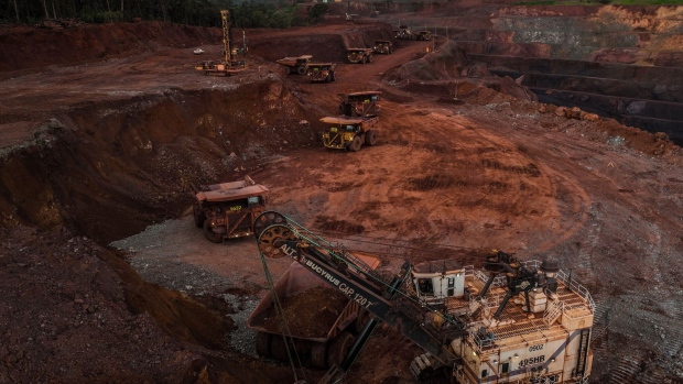 Excavators move iron ore into haul trucks at the Vale N4W mine in Parauapebas, Para state, Brazil, on Monday, May 15, 2023. Vale SA is plowing ahead with a $2.7 billion investment to expand iron output in Brazil's Amazon, betting demand for high-grade ore will stay strong in an overall softer market. Photographer: Dado Galdieri/Bloomberg