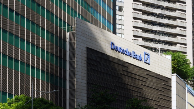 Signage for Deutsche Bank AG at the bank's office building in Singapore, on Thursday, April 18, 2024. Deutsche Bank plans to double the assets it manages for rich families in Southeast Asia and the Middle East over the next five years, tapping growing ties between ultra-rich clans in both regions, the lender's global private banking head said. Photographer: Ore Huiying/Bloomberg