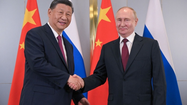 Vladimir Putin with Xi Jinping in Astana on July 3. Photographer: Sergei Guneyev/AFP/Getty Images