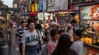 Shoppers at a night market in Taipei.